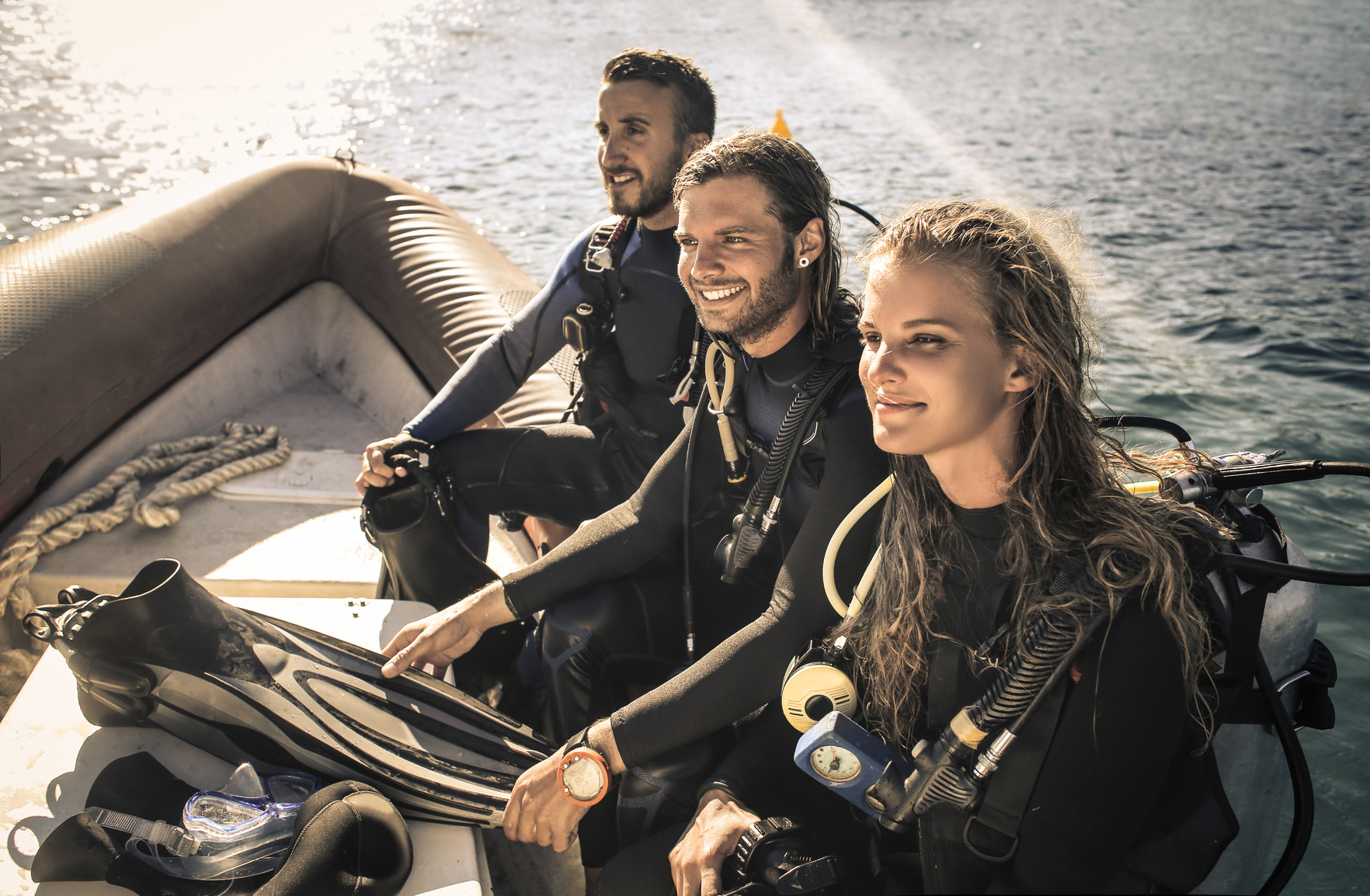 Group of scuba divers on a boat